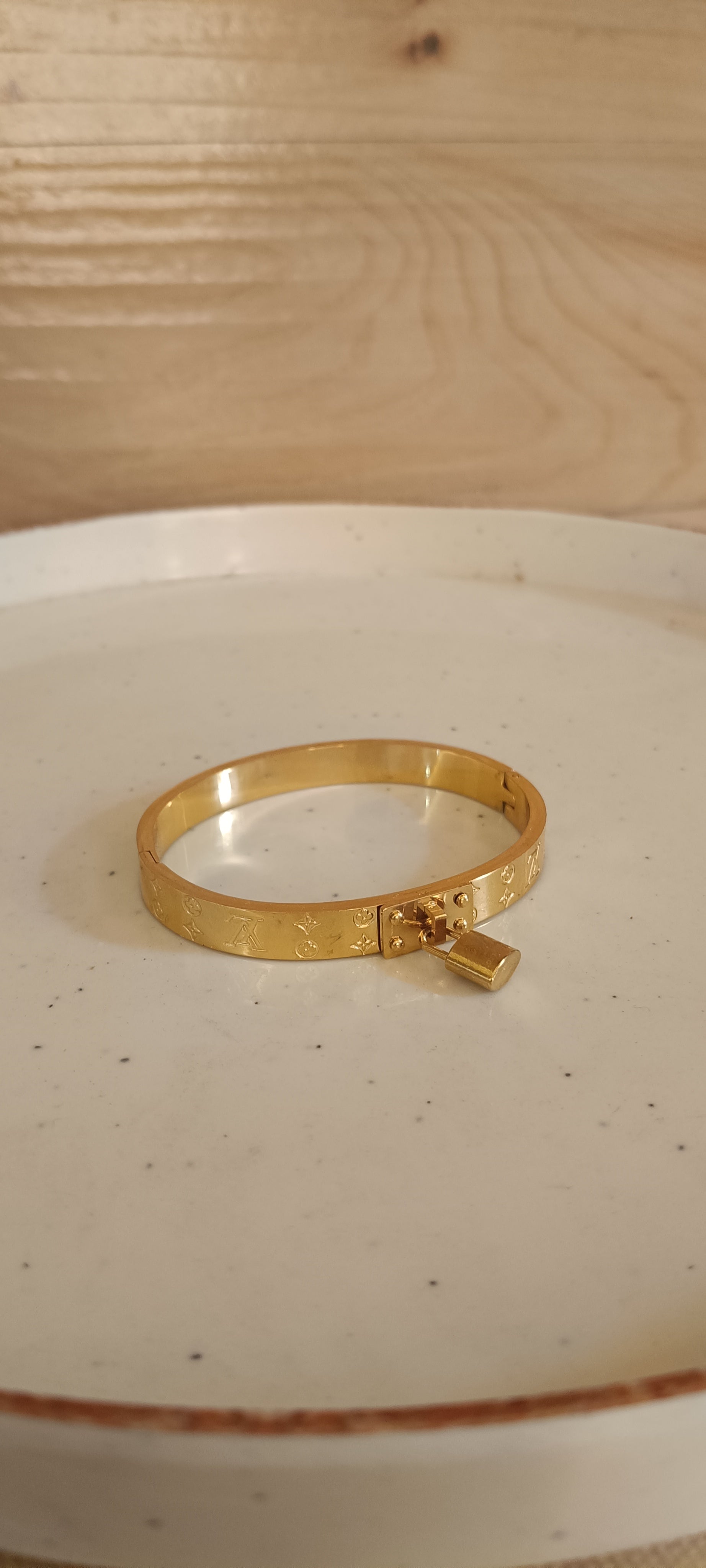 Lock in Your Luxury: The Golden Charm Bracelet